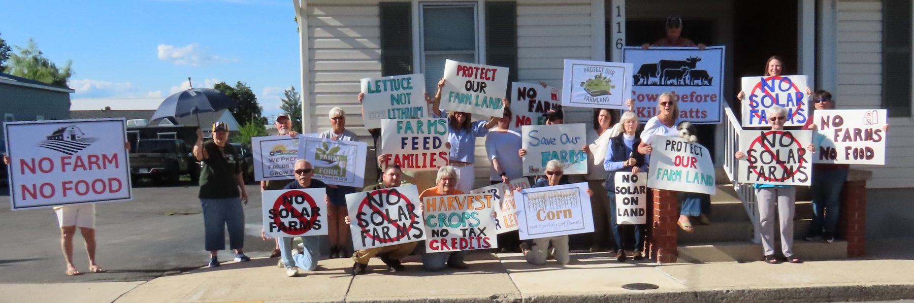 Hardy County residents gathered with handmade signs supporting farmland protection